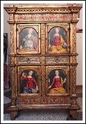 Beautiful ancient piece of furniture decorated with golden moulding