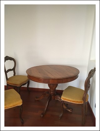 original oval table with decorated legs. nut wood